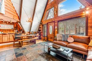 a living room with a couch and a table at A-Frame of Mind in Beech Mountain