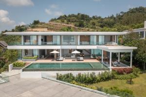 an aerial view of a house with a swimming pool at Villa Amylia Emerald, design excellence in Koh Samui