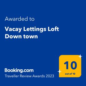 a yellow sign with the text awarded to waey lifts left down town at Vacay Lettings - Loft Downtown Dubai in Dubai