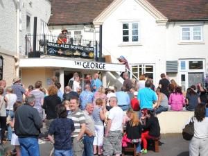 a crowd of people standing outside of a building at The George in Bridgnorth