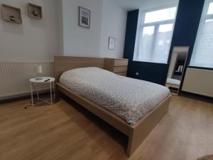Posteľ alebo postele v izbe v ubytovaní Résidence Jehan Froissart