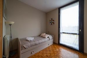 A bed or beds in a room at ISEO CHARME VILLAS
