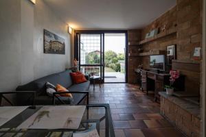 a living room with a couch and a table at ISEO CHARME VILLAS in Iseo