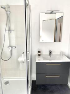 a bathroom with a sink and a shower at Le Chill Loft in Miramont-de-Guyenne +20 photos