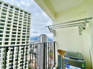 a balcony with a view of a building at Gold Coast Luxury Apartment Nha Trang in Nha Trang