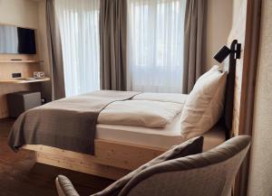 Letto o letti in una camera di Gasthaus zur Waldegg