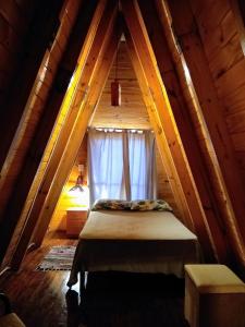 Llit o llits en una habitació de CHE RAJY