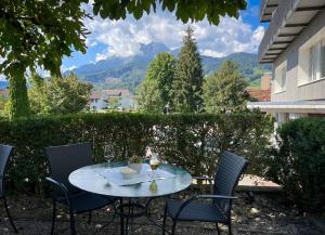 a table with wine glasses sitting on a patio at Gasthaus zur Waldegg in Luzern +34 photos