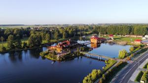 an aerial view of a house on an island in the water at Malibu Lublin in Lublin