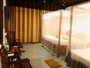 Letto o letti in una camera di Mango Tree House
