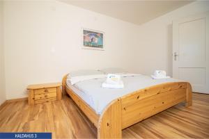 Postel nebo postele na pokoji v ubytování Haus Haldahus by Arosa Holiday