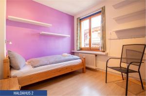 Postel nebo postele na pokoji v ubytování Haus Haldahus by Arosa Holiday