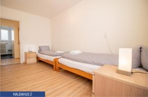 Postel nebo postele na pokoji v ubytování Haus Haldahus by Arosa Holiday