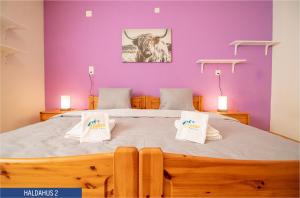 Postel nebo postele na pokoji v ubytování Haus Haldahus by Arosa Holiday