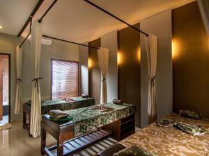 Postel nebo postele na pokoji v ubytování De Munut Balinese Resort