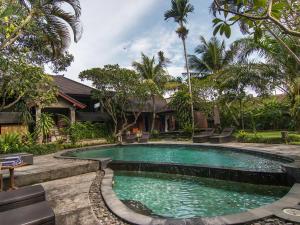 Bazén v ubytování De Munut Balinese Resort nebo v jeho okolí