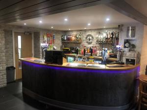 a bar in a pub with a counter top at 2 Bedroom apartment, Cononley near Skipton in Cononley