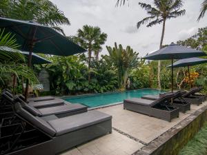Bazén v ubytování De Munut Balinese Resort nebo v jeho okolí