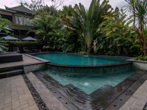 Bazén v ubytování De Munut Balinese Resort nebo v jeho okolí