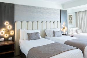 En eller flere senger på et rom på Hotel HW High Wellness