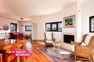 a living room with a couch and a fireplace at Villa Montedoro Luxury in Noci