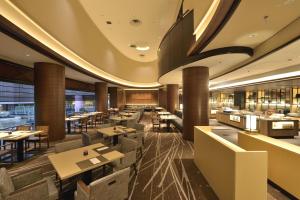 an image of a restaurant with tables and chairs at Kyoto Tokyu Hotel in Kyoto +85 photos