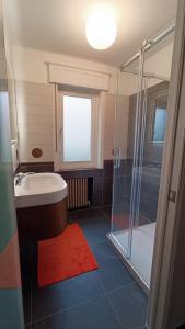 a bathroom with a tub and a glass shower at HIDDEN GEM Centre of BRUGES free PARKING in Bruges