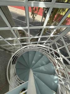 an overhead view of a spiral staircase in a building at Adeje Luxury Apartment in the south of Tenerife in Adeje