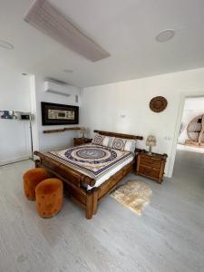 a bedroom with a bed and a table and chairs at Adeje Luxury Apartment in the south of Tenerife in Adeje