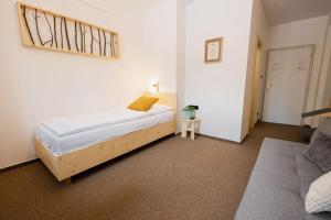 Ένα ή περισσότερα κρεβάτια σε δωμάτιο στο Hotel Rehavital