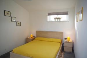 A bed or beds in a room at Villa Flores a Mondello by Wonderful Italy