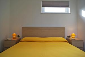 A bed or beds in a room at Villa Flores a Mondello by Wonderful Italy