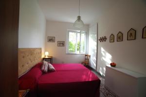 A bed or beds in a room at Villa Flores a Mondello by Wonderful Italy