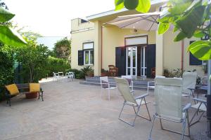 A patio or other outdoor area at Villa Flores a Mondello by Wonderful Italy