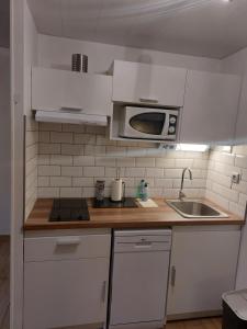 Kuchyň nebo kuchyňský kout v ubytování Appartement comme à la maison