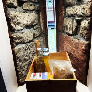 a box with a bottle of beer in it at Sheildaig Farm in Balloch