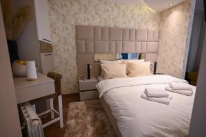 Postel nebo postele na pokoji v ubytování BANE APARTMANI 6