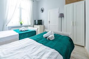 Posteľ alebo postele v izbe v ubytovaní Wawel Castle Apartment