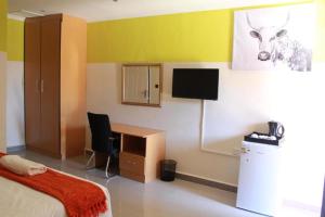 TV a/nebo společenská místnost v ubytování Apple Guesthouse