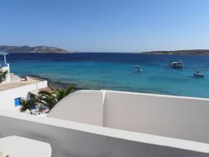 a view of the ocean with boats in the water at Glaros Rooms in Koufonisia