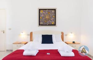 A bed or beds in a room at Villino Fonte del Mare