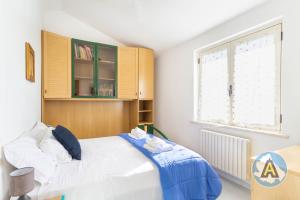 A bed or beds in a room at Villino Fonte del Mare