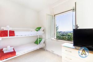 A television and/or entertainment centre at Villino Fonte del Mare