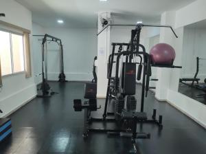 a gym with several tread machines in a room at Apê - Parque Industrial - SJC - SP in São José dos Campos