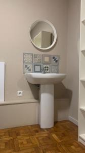 a bathroom with a sink and a mirror at Somnio Hostels in Barcelona