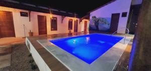 a swimming pool in the middle of a house at Kbanas Milagres in São Miguel dos Milagres