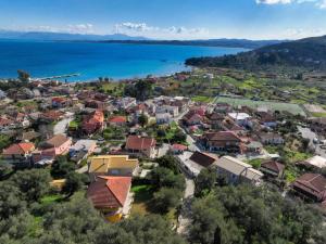 an aerial view of a town next to the water at Sea View Home - Rena's House in Corfu