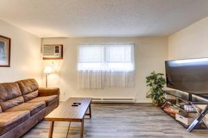 a living room with a couch and a flat screen tv at Pet-Friendly Pierre Vacation Rental! in Pierre