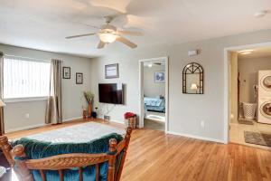 a living room with a couch and a ceiling fan at Pierre Vacation Rental with Grill and Fenced Yard in Pierre