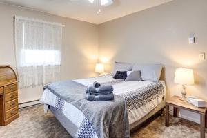a bedroom with a bed with towels on it at Pierre Vacation Rental - 9 Mi to Oahe Dam! in Pierre